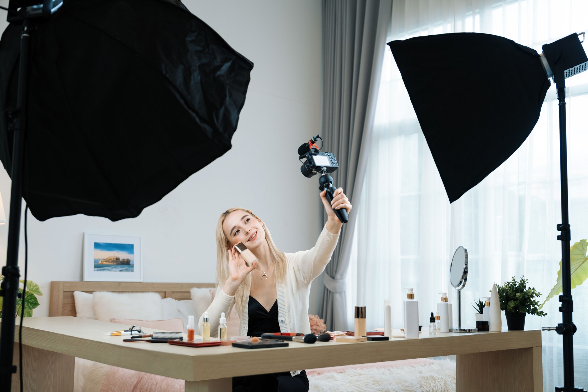 Young woman making beauty and cosmetic tutorial video content. Blithe